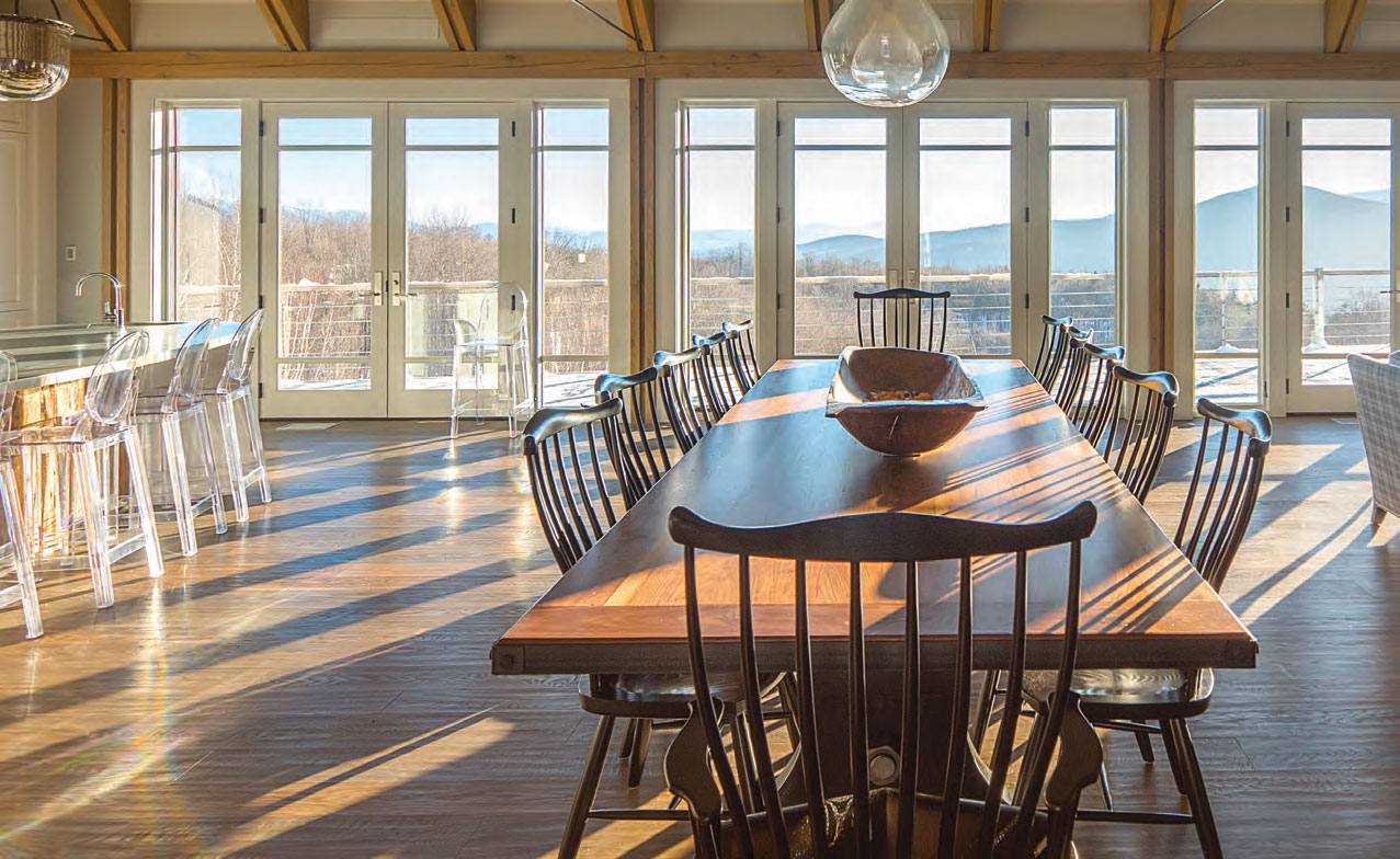 Every room and every feature (including the clear acrylic bar stools and 16-and-a-half-foot kitchen island, above) keys into at least one of the owners’ goals in terms of both style and practicality...and also keeps nonessential elements in the background.