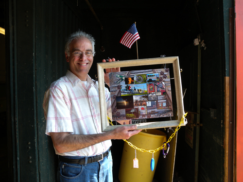 Roy Feldman, head of SEABA Burlington poses with completed image donated for the silent auction tonight at the annual party. Big Picture Frame helped with the final design.